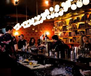 Estrella Damm Culinary Journey | People drinking at the bar at Mrs. Robinson